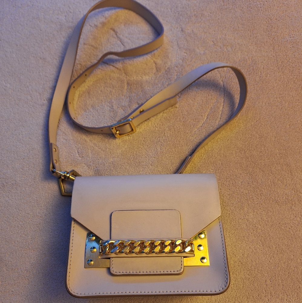 Elegant Cream Crossbody Bag with Gold Accents
